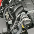 Load image into Gallery viewer, J&amp;L 22-25 Subaru BRZ/GR86 2.4L Passenger Side Oil Separator 3.0 - Clear Anodized - Side View