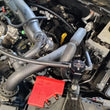 Load image into Gallery viewer, J&amp;L 24-25 Ford Ranger Raptor 3.0L PCV Side Oil Separator - Black Anodized - Detail View