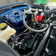 Load image into Gallery viewer, J&amp;L 24+ Ford Mustang 5.0L (w/ Whipple Supercharger) Oil Separator - 3.0 CCV Side Black Anodized - Back View
