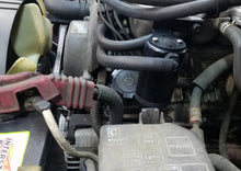 Load image into Gallery viewer, J&amp;L 95-04 Toyota Tacoma/4Runner 3.4L Driver Side Oil Separator 3.0 - Black Anodized - Side View