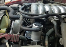 Load image into Gallery viewer, J&amp;L 95-04 Toyota Tacoma/4Runner 3.4L Driver Side Oil Separator 3.0 - Clear Anodized - Side View