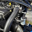 Load image into Gallery viewer, J&amp;L 24-26 Ford Mustang EcoBoost Driver Side Oil Separator 3.0 - Clear Anodized - Side View