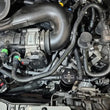 Load image into Gallery viewer, J&amp;L 2025 Ford Transit 150/250/350 3.5L Oil Separator - Black Anodized - Side View