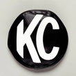 Load image into Gallery viewer, KC HiLiTES 6in. Round Soft Cover (Pair) - Black w/Yellow KC Logo - Back View