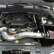 Load image into Gallery viewer, K&amp;N 05-09 Nissan Pathfinder/Xterra/Frontier V6-4.0L 77 Series High Flow Performance Kit - Installation View