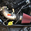 Load image into Gallery viewer, K&amp;N 12-15 Jeep Grand Cherokee SRT 8 6.4L V8 High Flow Performance Intake Kit - Installation View