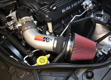 Load image into Gallery viewer, K&amp;N 12-15 Jeep Grand Cherokee SRT 8 6.4L V8 High Flow Performance Intake Kit - Installation View