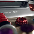 Load image into Gallery viewer, KW 04-05 Porsche Carrera GT Special Edition HLS4 V5 Coilover Kit w/ Red &amp; Blue Springs - Installation View