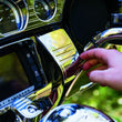 Load image into Gallery viewer, Kuryakyn Deluxe Tri-Line Stereo Trim Kit 14-Up Touring Models Chrome - Side View