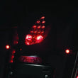 Load image into Gallery viewer, Kuryakyn Micro 1000 Dual Function Smoke Lens Red/Red/Amber Satin Black - Side View