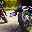 Load image into Gallery viewer, Kuryakyn Nova Side Mount License Plate Frame Gloss Black - Side View
