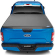 Load image into Gallery viewer, Lund 16-23 Toyota Tacoma (5ft. Bed) Genesis Elite Tri-Fold Tonneau Cover - Black - Installation View