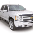 Load image into Gallery viewer, Lund 01-13 Chevy Silverado 1500 Crew Cab 5in. Oval Curved Steel Nerf Bars - Black - Installation View
