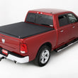 Load image into Gallery viewer, Lund 02-17 Dodge Ram 1500 (5.5ft. Bed) Genesis Elite Tri-Fold Tonneau Cover - Black - Side View