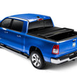 Load image into Gallery viewer, Lund 02-17 Dodge Ram 1500 (5.5ft. Bed) Genesis Elite Tri-Fold Tonneau Cover - Black - Installation View
