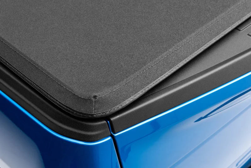 Lund 04-14 Ford F-150 (5.5ft. Bed) Genesis Elite Tri-Fold Tonneau Cover - Black - Additional View 7