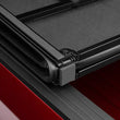 Load image into Gallery viewer, Lund 04-15 Nissan Titan (5.5ft. Bed) Hard Fold Tonneau Cover w/Bracket Kit - Black - Additional View 12