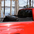 Load image into Gallery viewer, Lund 04-15 Nissan Titan (5.5ft. Bed) Hard Fold Tonneau Cover w/Bracket Kit - Black - Additional View 16