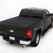 Load image into Gallery viewer, Lund 07-13 Chevy Silverado 1500 (6.5ft. Bed) Genesis Elite Tri-Fold Tonneau Cover - Black - Side View