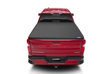 Load image into Gallery viewer, Lund 07-13 Chevy Silverado 1500 (6.5ft. Bed) Genesis Elite Tri-Fold Tonneau Cover - Black - Installation View