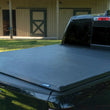 Load image into Gallery viewer, Lund 07-13 Chevy Silverado 1500 (6.5ft. Bed) Genesis Tri-Fold Tonneau Cover - Black - Additional View 7