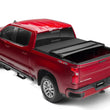Load image into Gallery viewer, Lund 14-17 Chevy Silverado 1500 (8ft. Bed) Genesis Elite Tri-Fold Tonneau Cover - Black - Installation View
