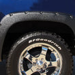 Load image into Gallery viewer, Lund 99-07 Chevy Silverado 1500 RX-Rivet Style Textured Elite Series Fender Flares - Black (4 Pc.) - Installation View
