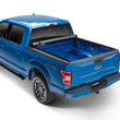 Load image into Gallery viewer, Lund 99-07 Ford F250/F350/F450 Super Duty (8ft bed) Genesis Roll Up Tonneau Cover - Black - Side View