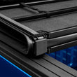 Load image into Gallery viewer, Lund 99-17 Ford F-250 Super Duty Styleside (6.8ft. Bed) Hard Fold Tonneau Cover - Black - Additional View 5