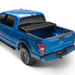 Load image into Gallery viewer, Lund 99-17 Ford F-250 Super Duty Styleside (6.8ft. Bed) Hard Fold Tonneau Cover - Black - Additional View 10