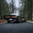 Load image into Gallery viewer, MBRP 17-Up Dodge Challenger 5.7L/6.2L/6.4L Carbon Fiber Quad Tip T304 Catback Exhaust - Installation View