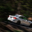 Load image into Gallery viewer, MBRP 18-22 BMW M2 Competition 3.0L T304 SS 3in Resonator-Back Exhaust Quad Rear w/ Carbon Fiber Tips - Installation View
