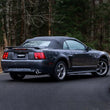 Load image into Gallery viewer, MBRP 99-04 Ford Mustang GT 4.6L 2.5in. Dual Split Rear AL Cat Back w/ 3.5in. Dual Wall Blk. Tips - Installation View