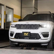 Load image into Gallery viewer, MagnaFlow NEO Series Cat-Back Exhaust fits 2022-2025 Jeep Grand Cherokee - Installation View