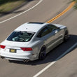 Load image into Gallery viewer, MagnaFlow Sys C/B 2015-2017 Volkswagen Golf R 3in Polished SS Quad Tip Split Rear Exit - Installation View