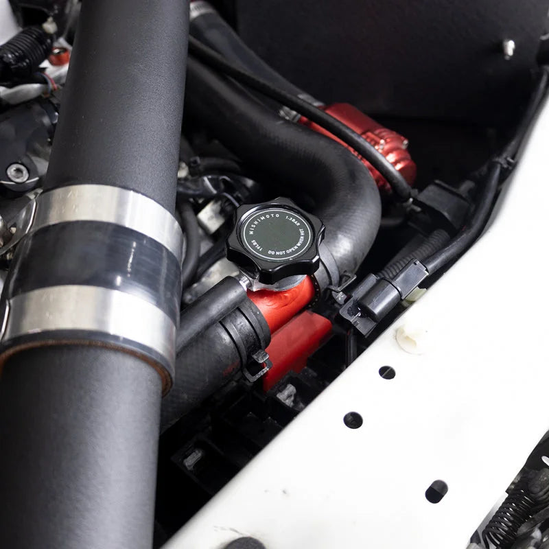 Mishimoto 08-15 Mitsubishi Lancer Evo X Coolant Fill Inlet - Black - Installation View