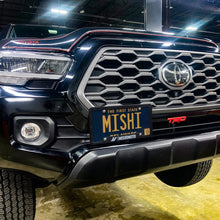 Load image into Gallery viewer, Mishimoto 16-23 Toyota Tacoma License Plate Relocation Kit - Installation View