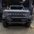 Load image into Gallery viewer, Mishimoto 2022+ Ford Bronco Capable Bumper License Plate Relocation - Installation View