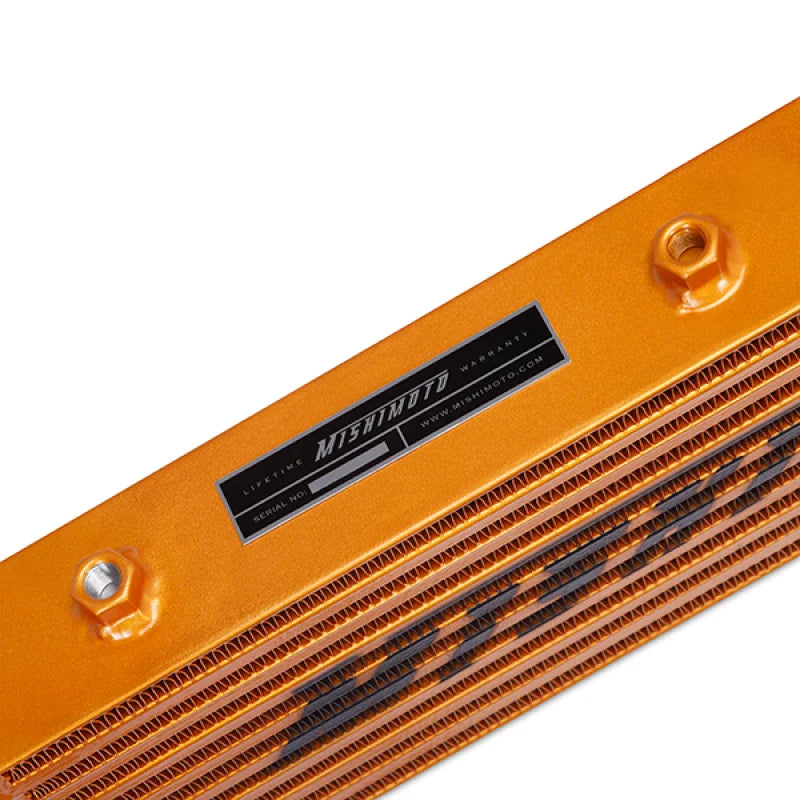 Mishimoto Universal Gold Z Line Intercooler  Overall Size: 28x8x3 Core Size: 21x6x2.5 Inlet / Outlet - Side View
