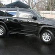 Load image into Gallery viewer, N-Fab Nerf Step 03-09 Toyota 4 Runner SUV 4 Door - Tex. Black - W2W - SRW - 2in - Back View