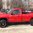Load image into Gallery viewer, N-Fab Nerf Step 11-14 Chevy-GMC 2500/3500 Regular Cab 8ft Bed - Tex. Black - Bed Access - 3in - Installation View