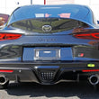 Load image into Gallery viewer, PERRIN 20-25 Toyota Supra Tow Hook Kit (Rear) - Neon Yellow - Side View