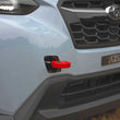 Load image into Gallery viewer, PERRIN 22-25 Subaru WRX / 18-23 Crosstrek / 20-25 OBXT / 17-23 Impreza Tow Hook Kit (Front) - Red - Side View