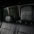 Load image into Gallery viewer, PRP 12-14 Ford Raptor  Rear Bench Seat Covers- Black with Silver Stitch - Installation View