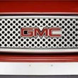 Load image into Gallery viewer, Putco 00-06 GMC Yukon XL - w/ Logo CutOut Punch Stainless Steel Grilles - Side View