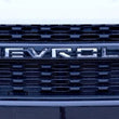 Load image into Gallery viewer, Putco 19-20 Chevy Silverado LD - Grille Letters - Stainless Steel Chevrolet Letters - Side View