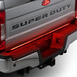 Load image into Gallery viewer, Putco 60in Red Blade LED Tailgate Light Bar for Ford Turcks w/ Blis and Trailer Detection - Installation View
