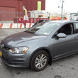Load image into Gallery viewer, Rally Armor 15-21 MKVII VW Golf/GTI Black UR Mud Flap w/White Logo - Installation View