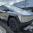 Load image into Gallery viewer, Rally Armor 24-25 Tesla Cybertruck Black UR Mud Flap Metallic Black Logo - Additional View 5