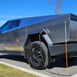 Load image into Gallery viewer, Rally Armor 24-25 Tesla Cybertruck Black UR Mud Flap Metallic Black Logo - Installation View